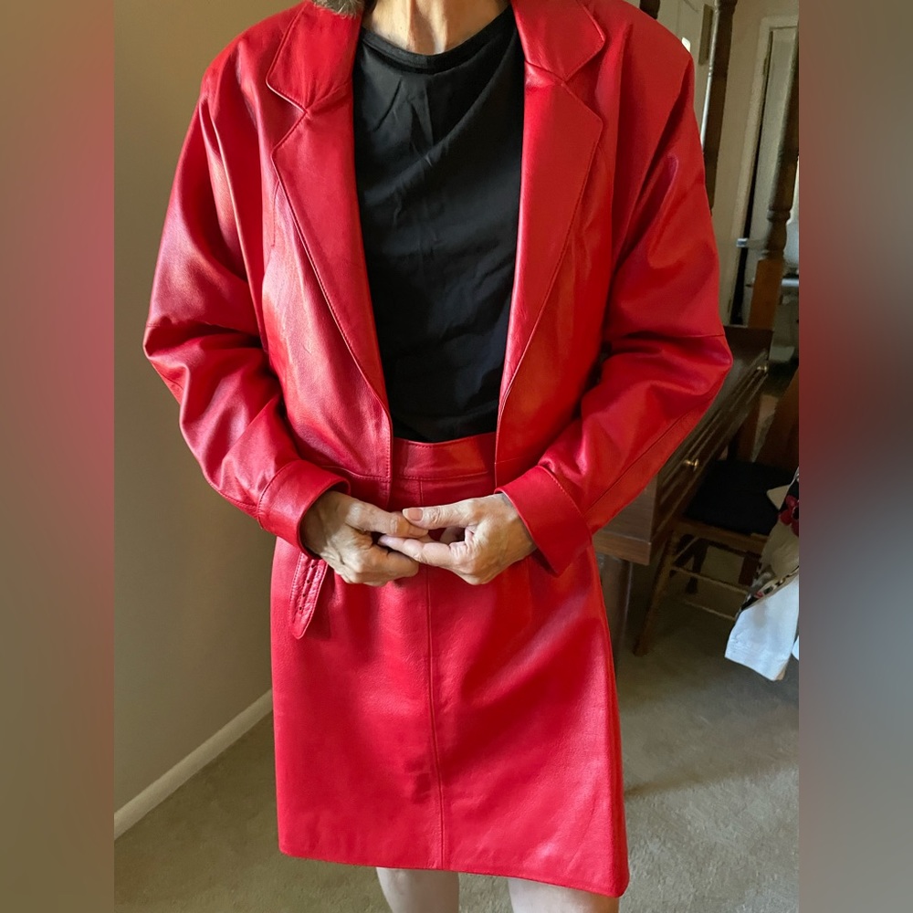 Gorgeous red leather jacket and skirt. Size small. Tailored in the USA.